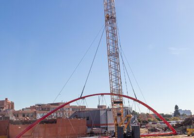 Crawler crane hoisting pedestrian bridge in Emeryville