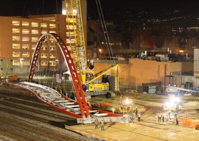 Crawler crane hoisting pedestrian bridge in Emeryville