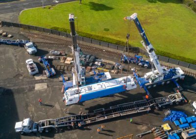 Cranes hoisting maintenance equipment for BART