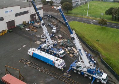Cranes hoisting maintenance equipment for BART