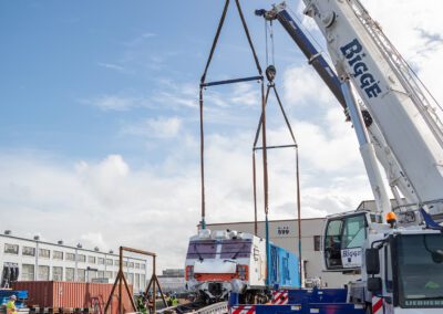 Cranes hoisting maintenance equipment for BART