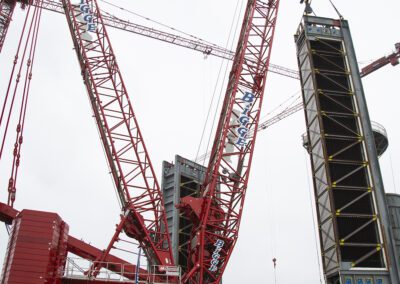 Cranes work at a power plant in Huntington Beach, California