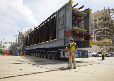 Cranes work at a power plant in Huntington Beach, California